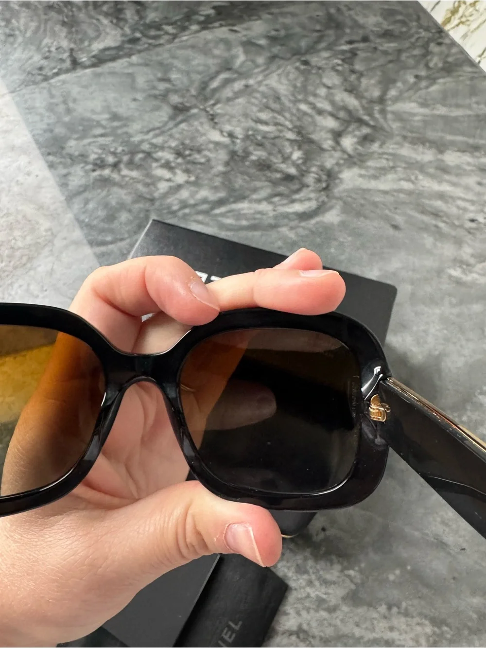 CHANEL Black Sunglasses with Gold Logo Accent